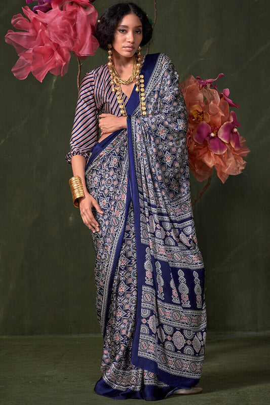 Appealing Navy Blue Ajrakh Printed Satin Silk Saree With Susurrous Blouse Piece