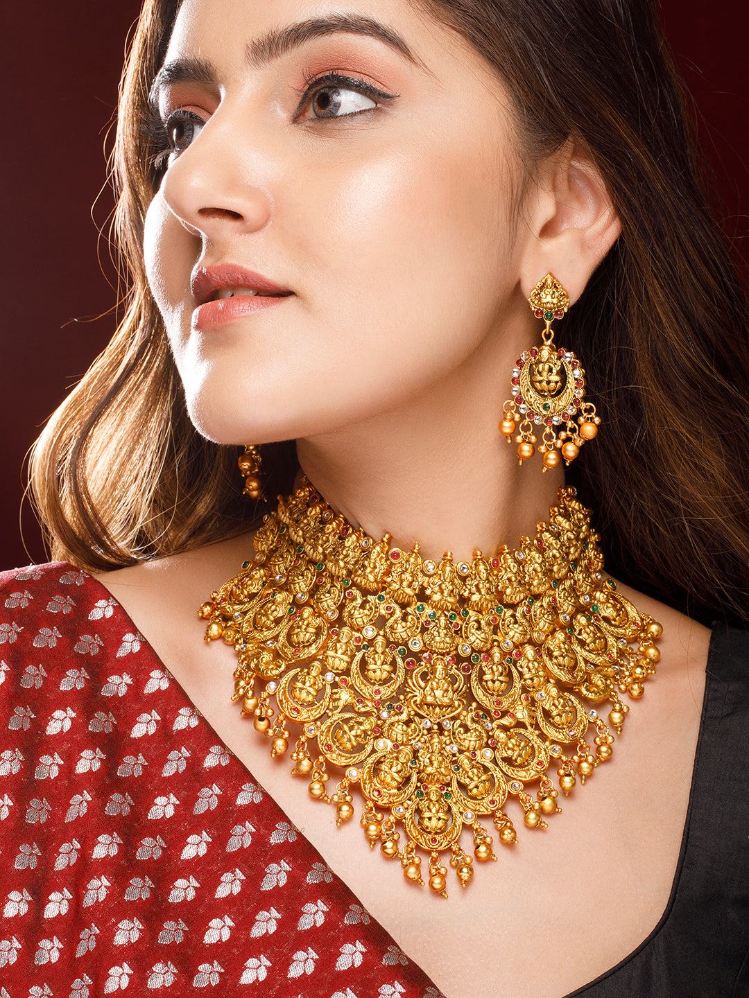 Wentra 22K Gold Plated Red, Green & White Stone Studded Lakshmi Motif Temple Jewellery Set