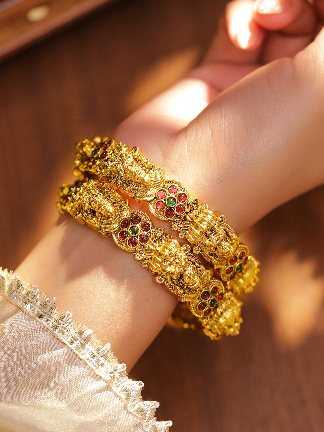 Wentra Set of 2 24K Gold-Plated Ruby Red & Green Stone Studded Temple Bangles with Lakshmi Motif