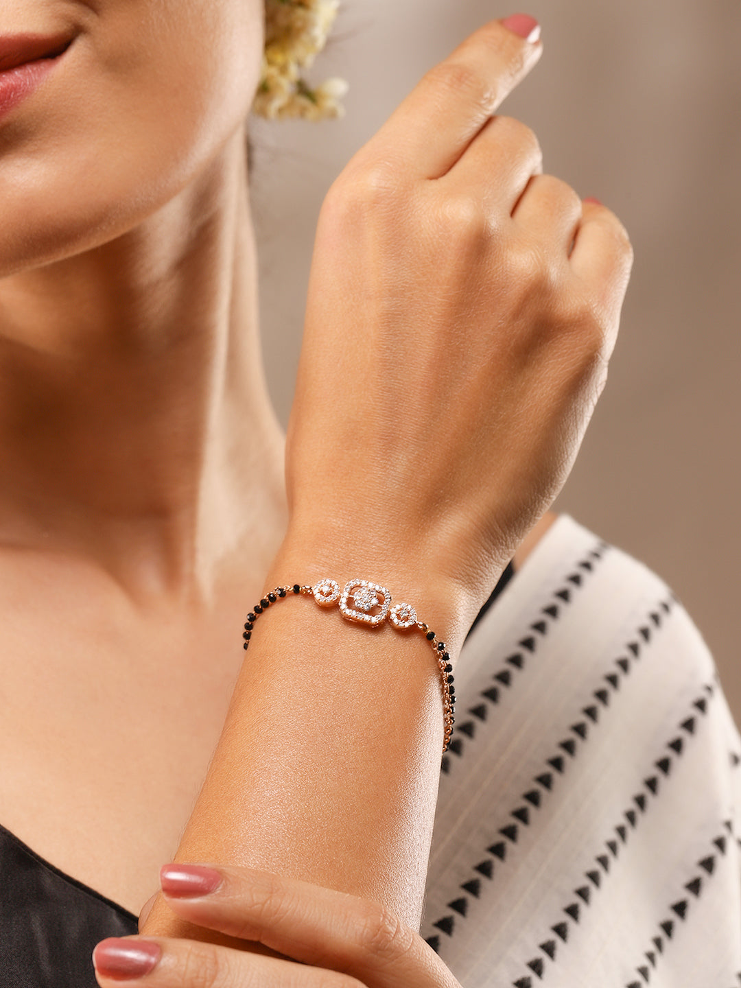 Wentra Rose Gold-Plated White Cubic Zirconia Studded Floral Mangalsutra Bracelet with Black Beads for Women