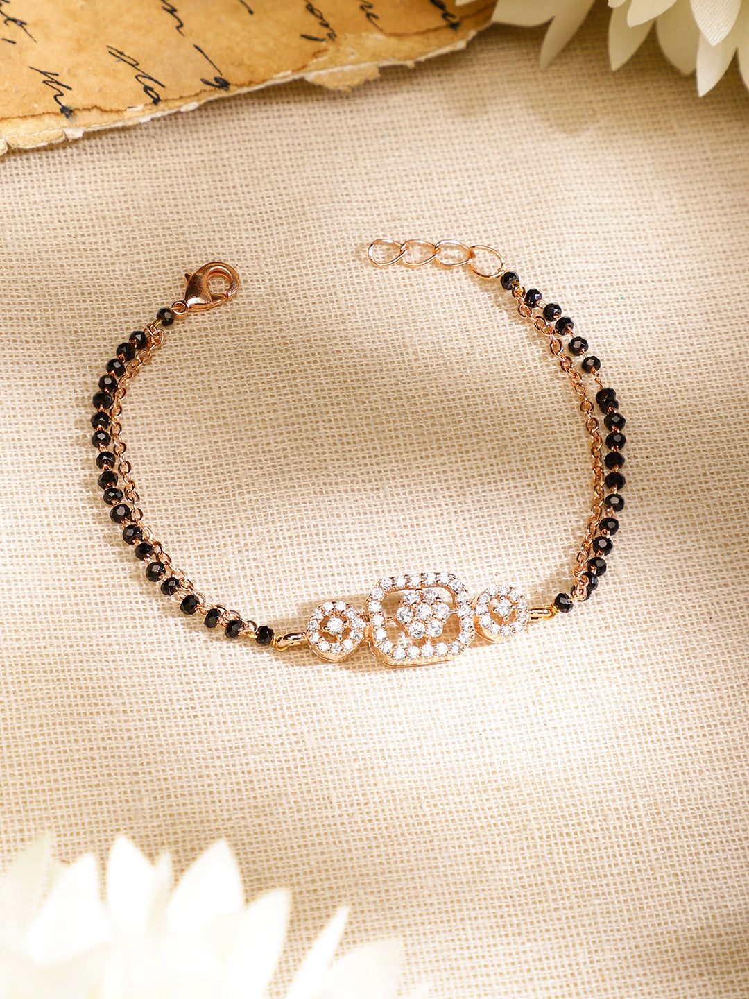 Wentra Rose Gold-Plated White Cubic Zirconia Studded Floral Mangalsutra Bracelet with Black Beads for Women