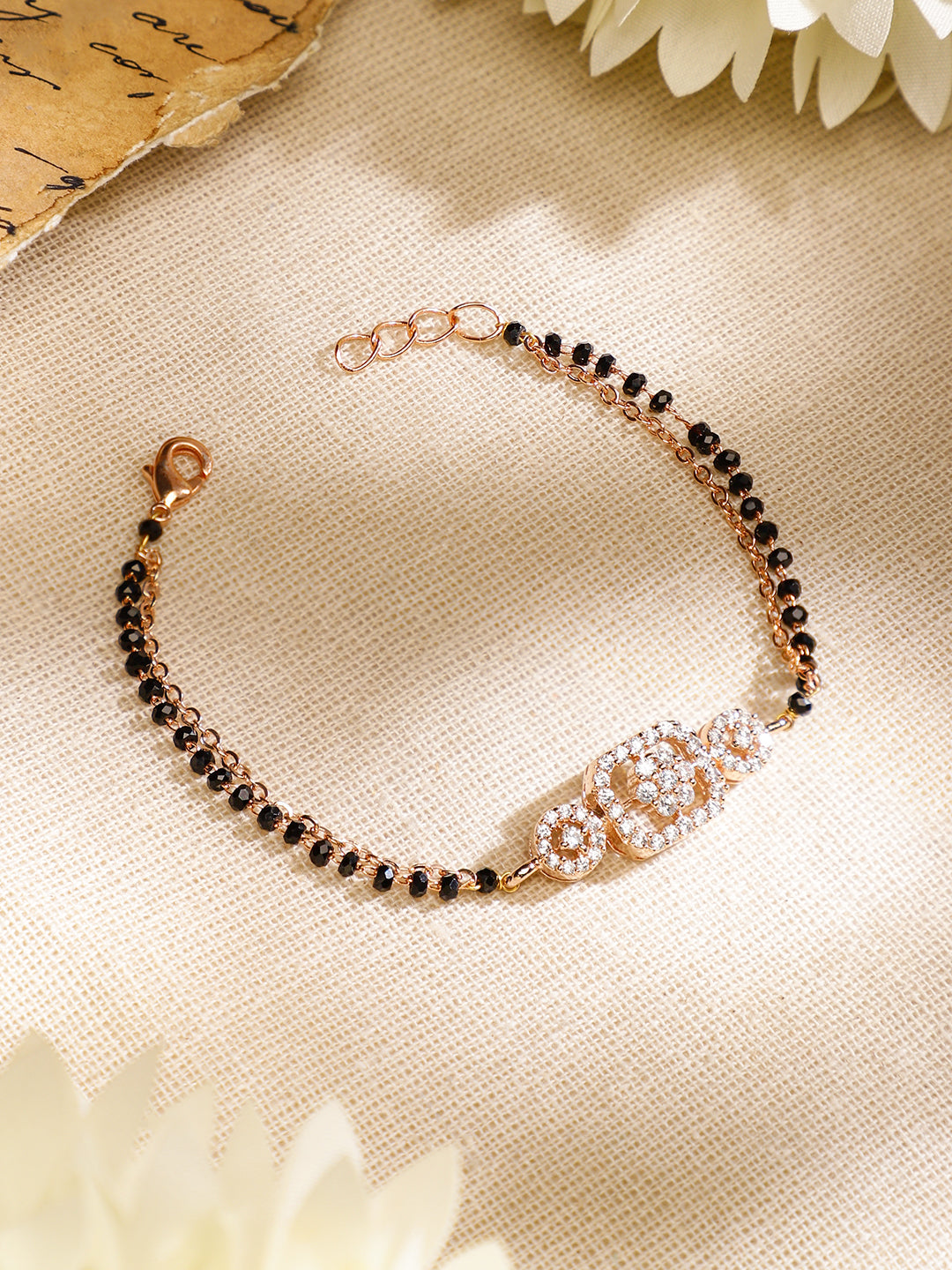 Wentra Rose Gold-Plated White Cubic Zirconia Studded Floral Mangalsutra Bracelet with Black Beads for Women