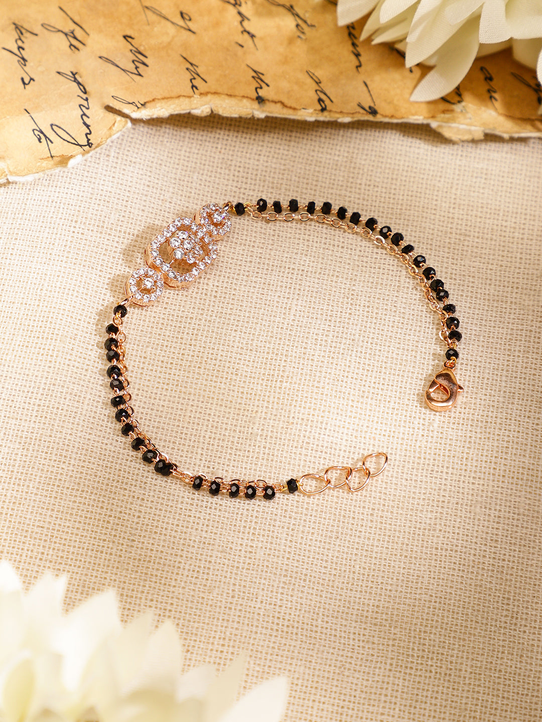 Wentra Rose Gold-Plated White Cubic Zirconia Studded Floral Mangalsutra Bracelet with Black Beads for Women