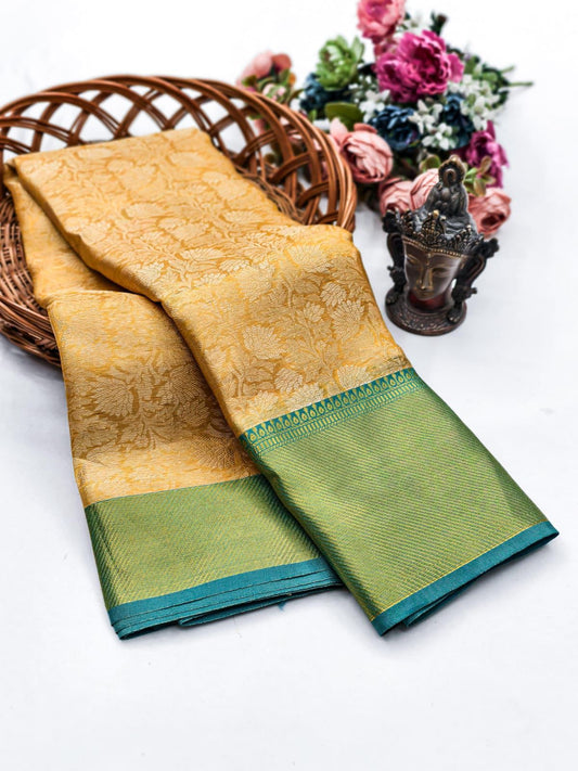 Mesmerising Golden Soft Tissue Silk Saree With Enigmatic Blouse Piece