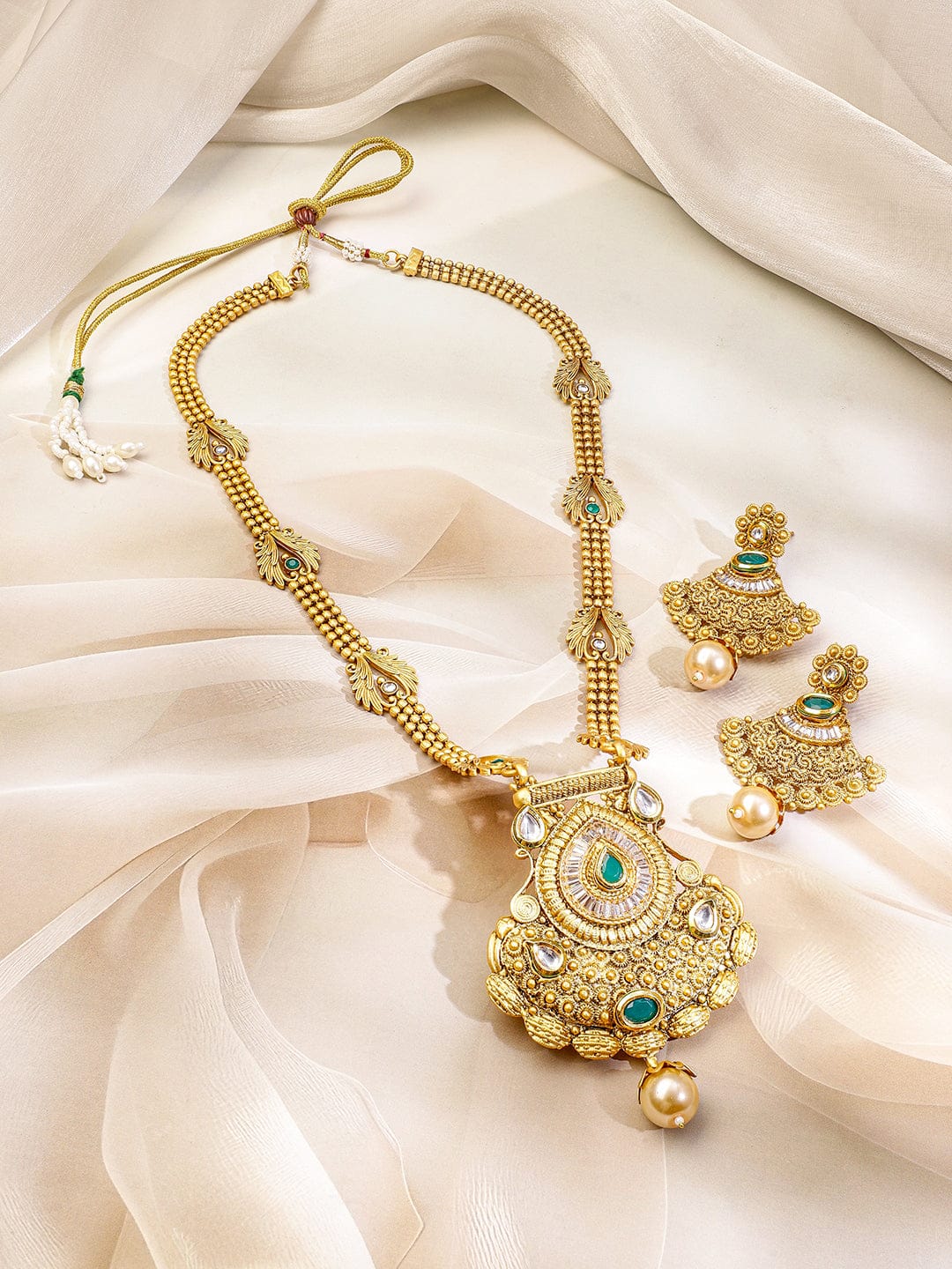 Emerald Studded Golden Necklace Set