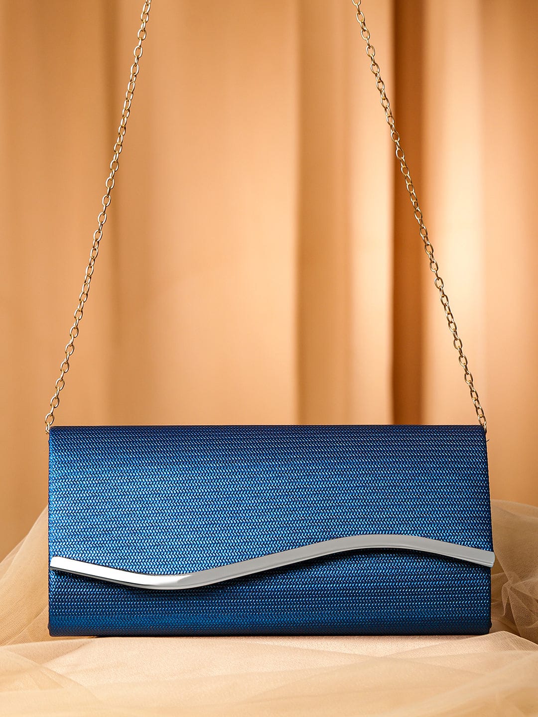 Wentra Blue Sapphire Glossy Textured Clutch with Silver-Tone Wavy Accent & Chain