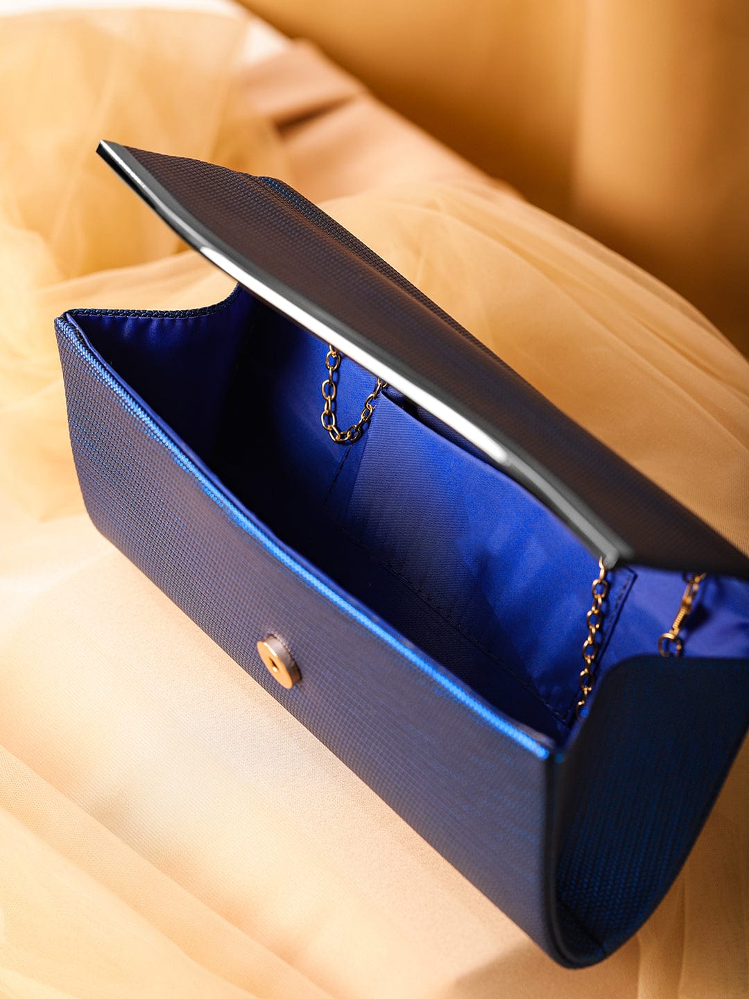Wentra Blue Sapphire Glossy Textured Clutch with Silver-Tone Wavy Accent & Chain