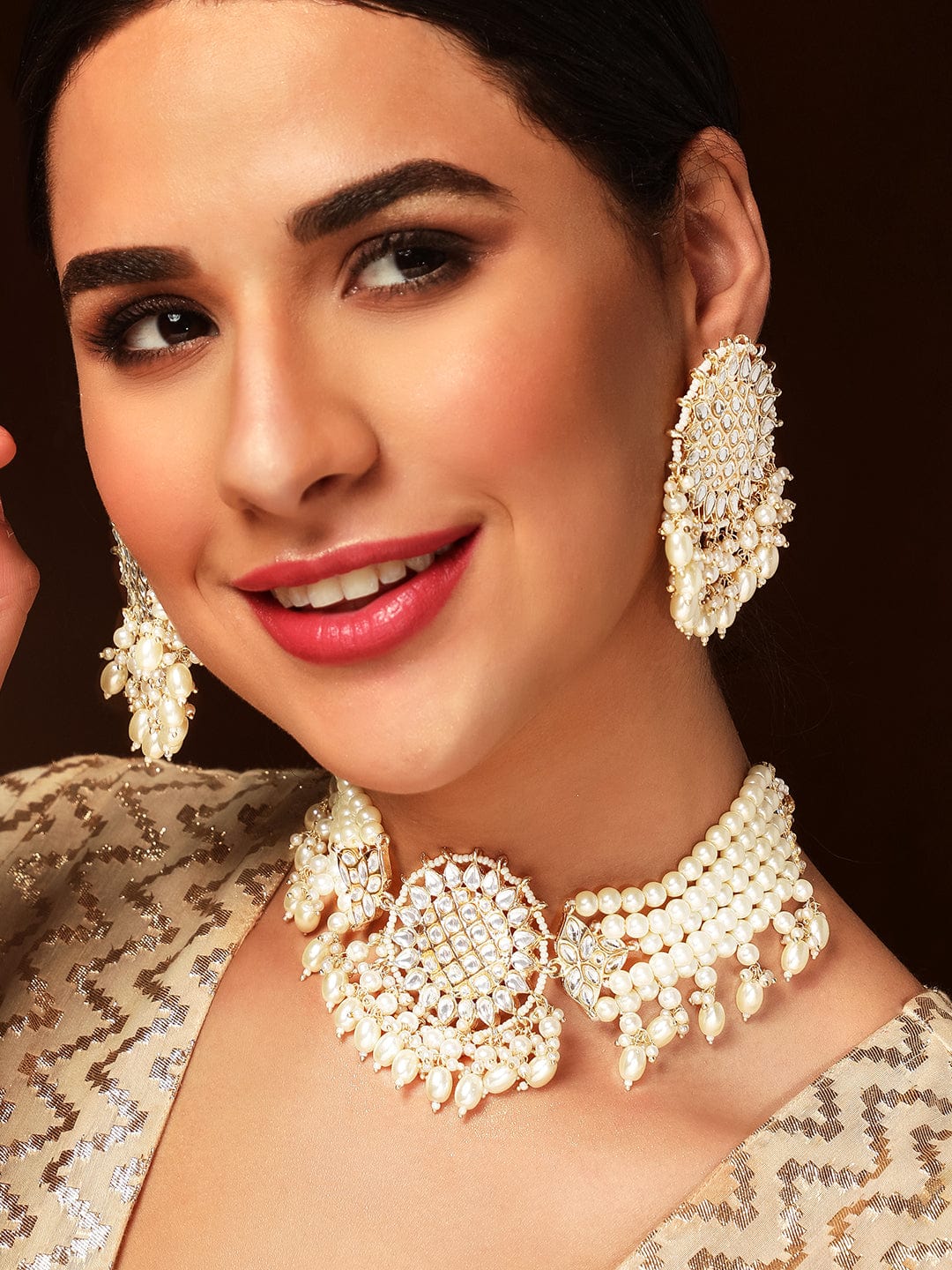 Wentra Gold Toned Kundan Studded Choker Set With Pearl Hangings.