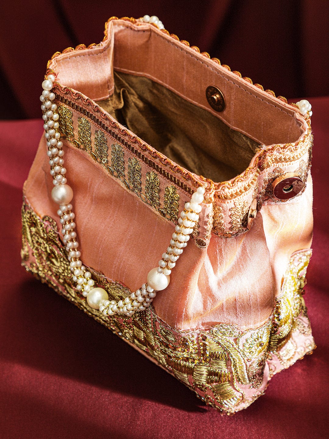 Wentra Handcrafted Peach Pink Silk Potli Bag with Pearl Handle & Gold Embroidered Elephant Motif