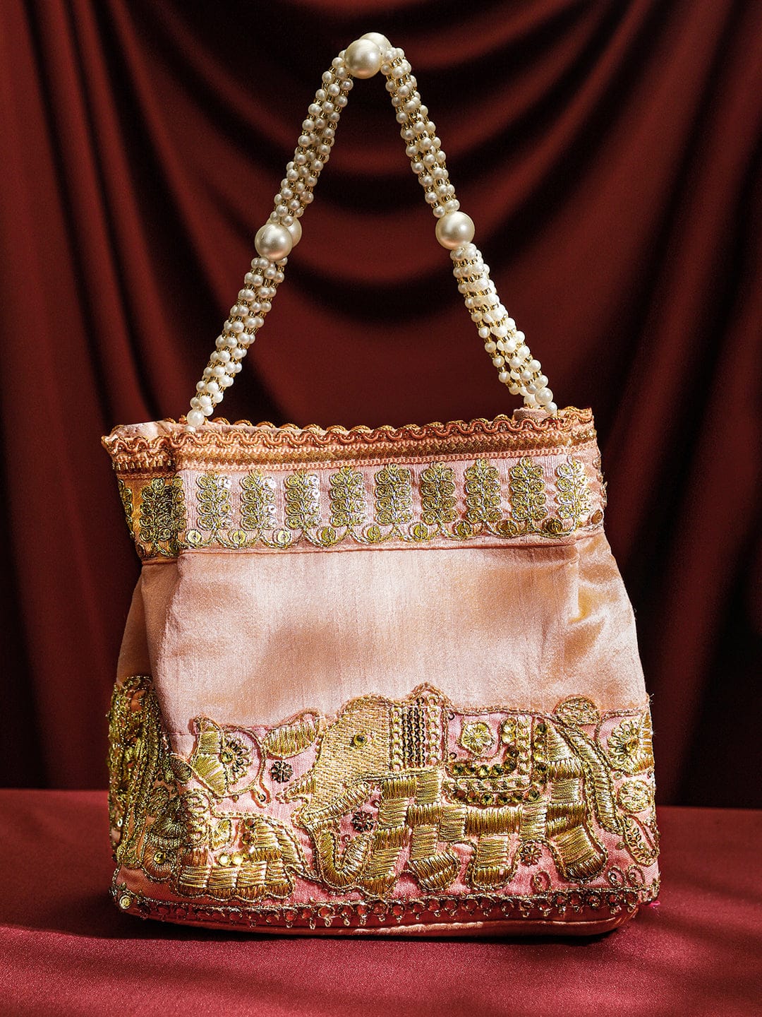 Wentra Handcrafted Peach Pink Silk Potli Bag with Pearl Handle & Gold Embroidered Elephant Motif