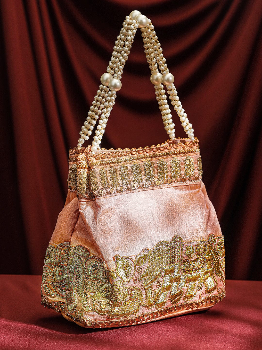 Wentra Handcrafted Peach Pink Silk Potli Bag with Pearl Handle & Gold Embroidered Elephant Motif