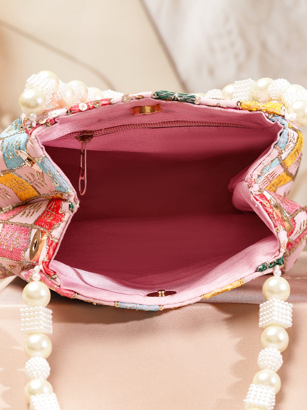 Wentra Multicolour Embroidered Potli Bag with Pearl Beaded Handle on Light Pink Base