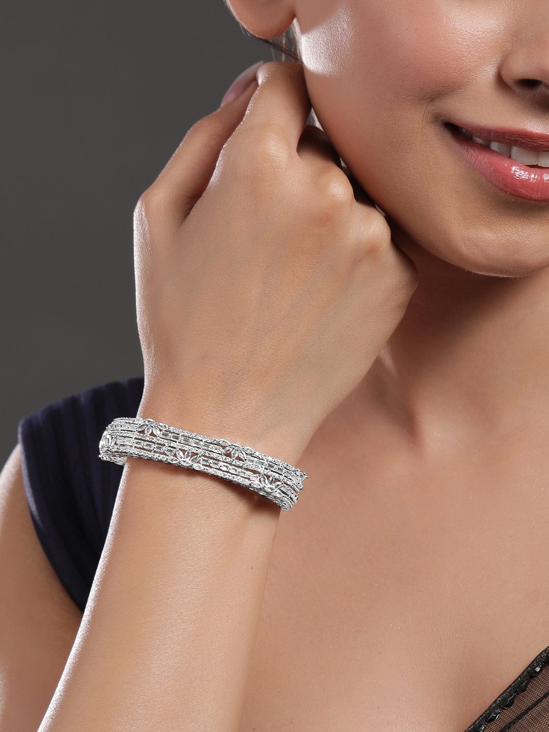 Wentra Rhodium Plated Cubic Zirconia Studded Floral Design Openable Bracelet