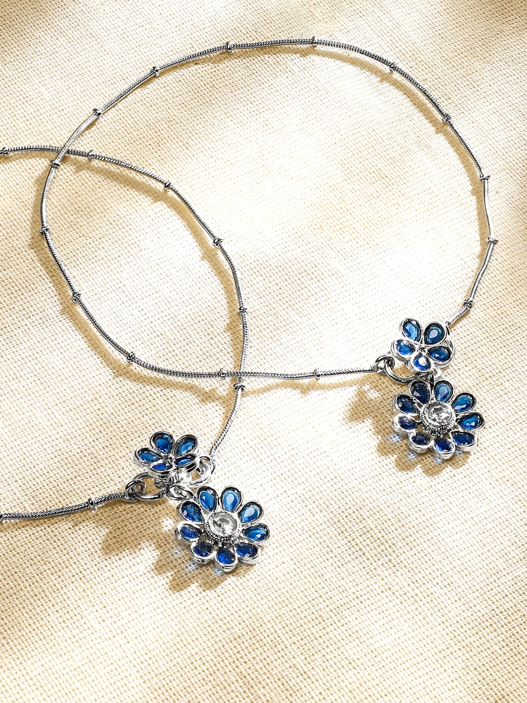 Wentra Set of 2 Oxidised Silver-Plated Blue Kundan Floral Charm Anklets