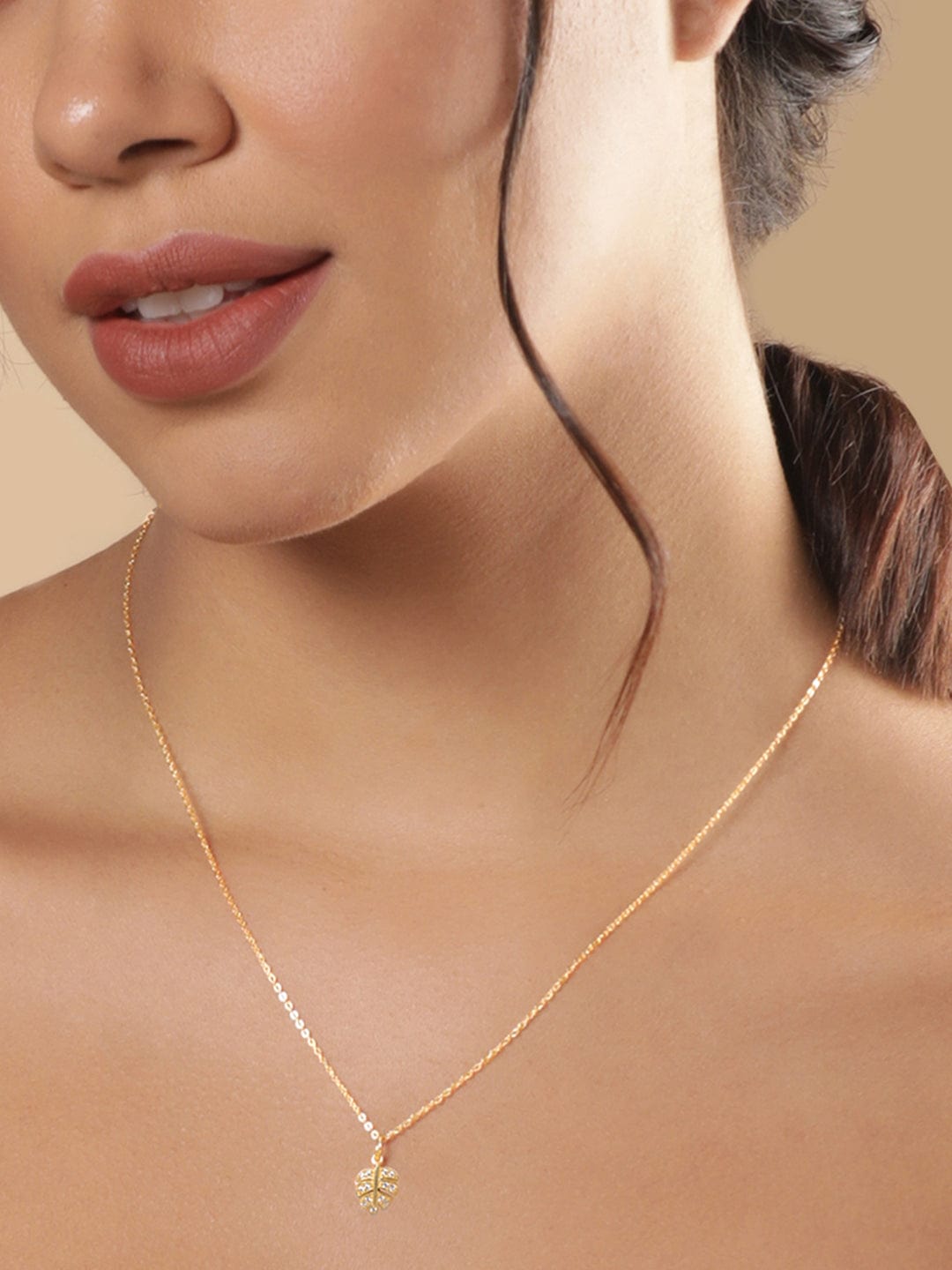 Crystal Studded Gold Toned Leaf Pendant Necklace