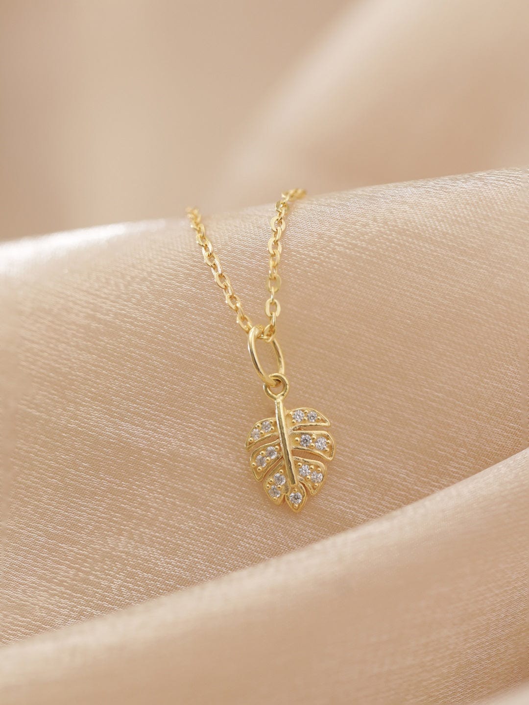Crystal Studded Gold Toned Leaf Pendant Necklace