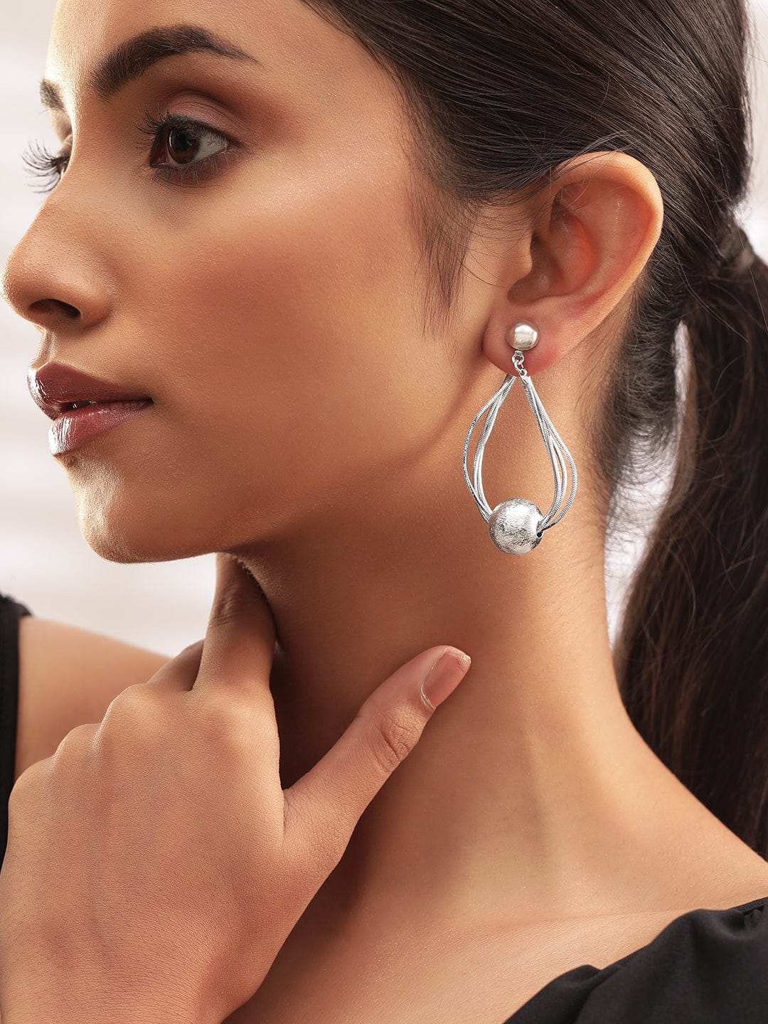 Dramatic Motion Silver Earrings