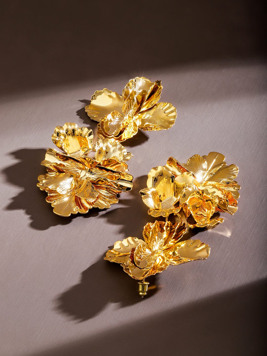 Gold Toned Leaf Motif Dangler Earrings